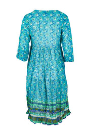 Product shot of the Rebecca 3/4 Sleeve Dress in colour Printr (Blue), from the back