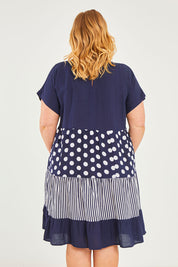 Model Caitlin wearing size 18 of the Nadia V Neck Linen Dress in colour Navy (Blue), from the back