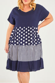 Model Caitlin wearing size 18 of the Nadia V Neck Linen Dress in colour Navy (Blue), from the front, cropped image