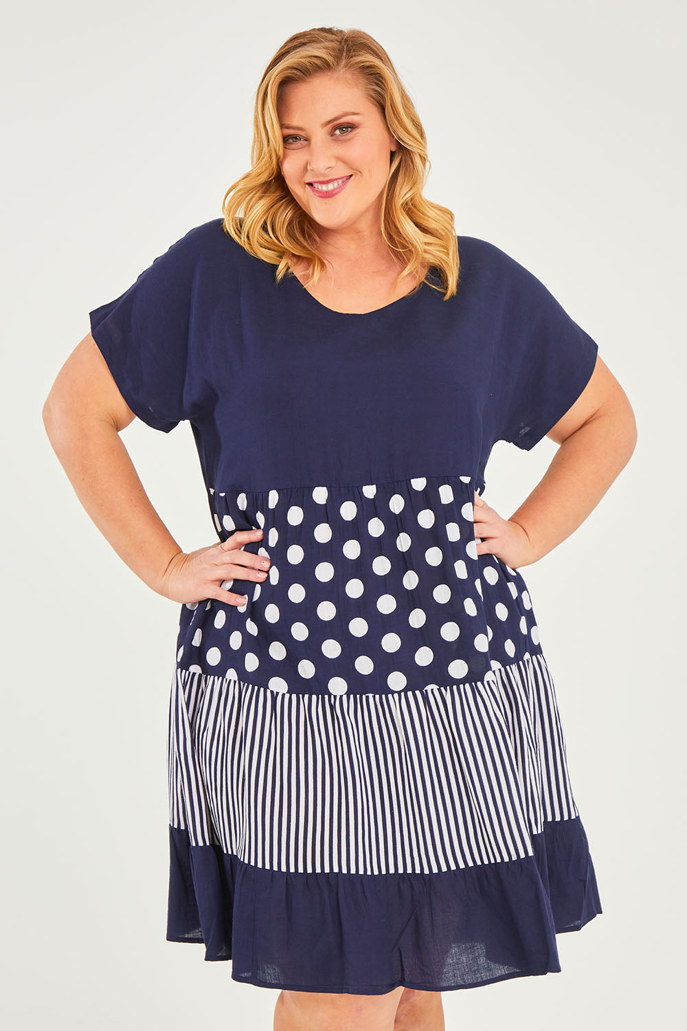 Model Caitlin wearing size 18 of the Nadia V Neck Linen Dress in colour Navy (Blue), from the front, cropped image