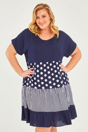 Model Caitlin wearing size 18 of the Nadia V Neck Linen Dress in colour Navy (Blue), from the front, cropped image