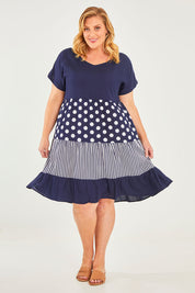 Model Caitlin wearing size 18 of the Nadia V Neck Linen Dress in colour Navy (Blue), from the front, showing the whole outfit