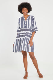 Model Aiyana wearing size 10 of the Maya Button V Neck Layer Dress in colour Navy (Blue), from the front, showing the whole outfit
