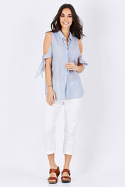 Model Georgia wearing size S of the Cooks Shirt in colour Stripes (White), from the front, showing the whole outfit