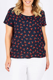 Model Jess wearing the First Mix Top in colour Cherry (Black), from the front, cropped image