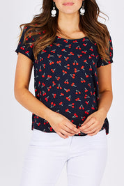 Model Madeline wearing the First Mix Top in colour Cherry (Black), from the front, cropped image