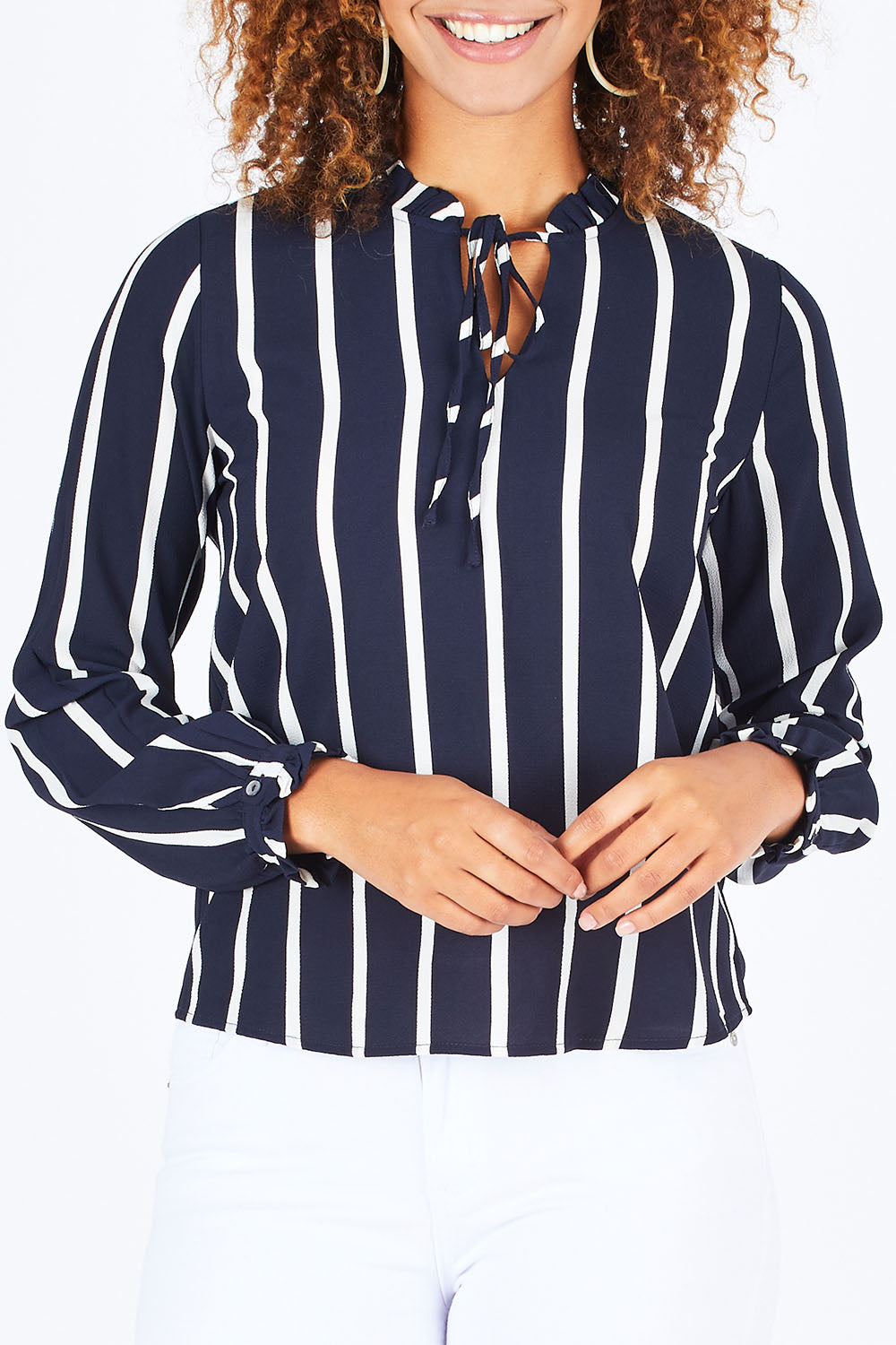 Model Summer wearing size S of the Nova Lux Long Sleeve Tie Top in colour AidaStripe (Black), from the front, cropped image