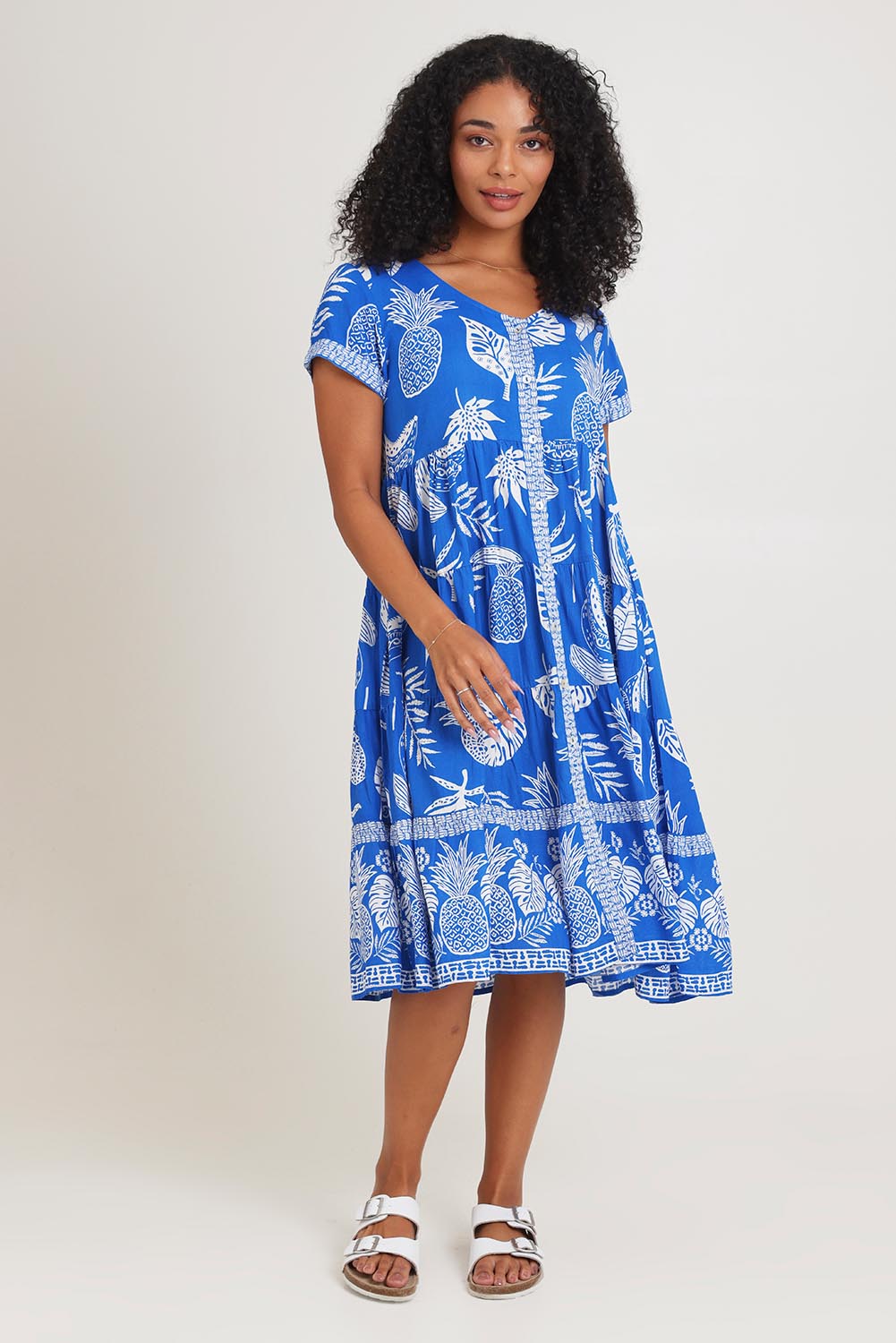 Model Ziara wearing size 10 of the Short Sleeve Layers Dress in colour Comodoro (Blue), from the front, showing the whole outfit