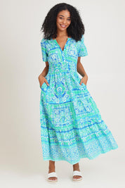 Model Ziara wearing size 10 of the Short Sleeve Cotton Midi Dress in colour Aqua (Blue), from the front, showing the whole outfit