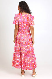 Model Pamelar wearing size 10 of the Short Sleeve Maxi Dress – Pink in colour Pink, from the front