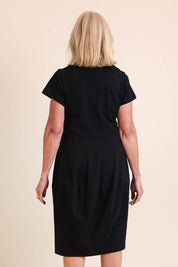 Model Sandys wearing size 10 of the Essentials Bubble Cotton Knit Dress - Black in colour Black, from the back