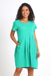 Model Pamelar wearing size 10 of the Essentials Bubble Cotton Knit Dress - Green in colour Green, from the front