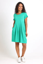 Model Pamelar wearing size 10 of the Essentials Bubble Cotton Knit Dress - Green in colour Green, from the front