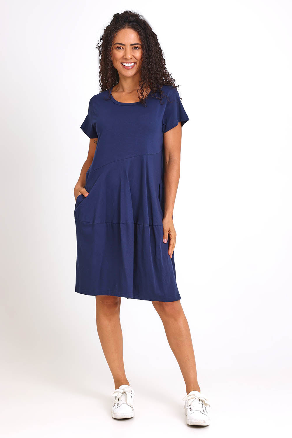 Model Pamelar wearing size 10 of the Essentials Bubble Cotton Knit Dress - Navy in colour Navy, from the front