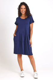 Model Pamelar wearing size 10 of the Essentials Bubble Cotton Knit Dress - Navy in colour Navy, from the front