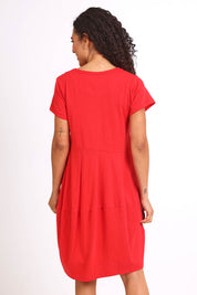 Model Pamelar wearing size 10 of the Essentials Bubble Cotton Knit Dress - Red in colour Red, from the back
