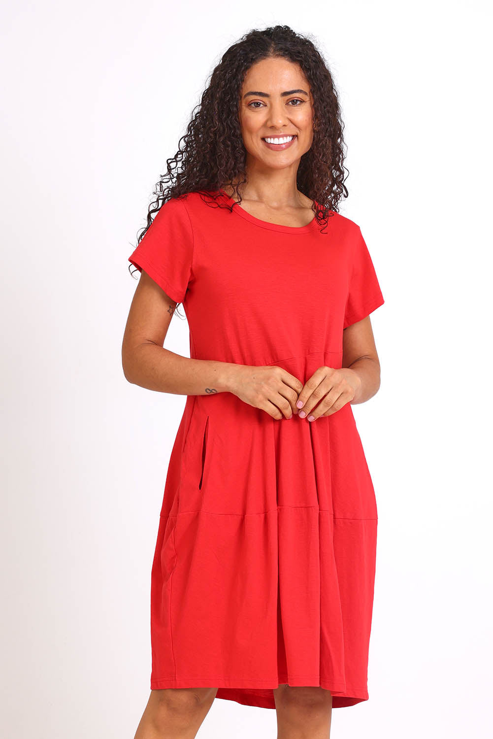 Model Pamelar wearing size 10 of the Essentials Bubble Cotton Knit Dress - Red in colour Red, in a cropped view