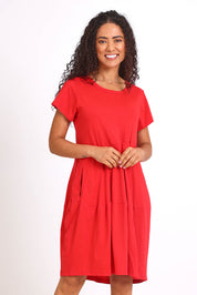 Model Pamelar wearing size 10 of the Essentials Bubble Cotton Knit Dress - Red in colour Red, in a cropped view