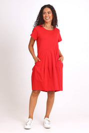 Model Pamelar wearing size 10 of the Essentials Bubble Cotton Knit Dress - Red in colour Red, from the front