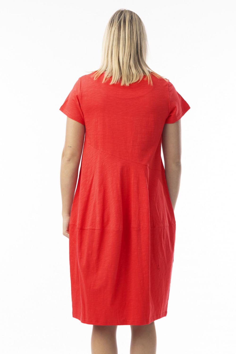 A model wearing the Essentials Organic Cotton Bubble Dress in colour Red (Red), from the back