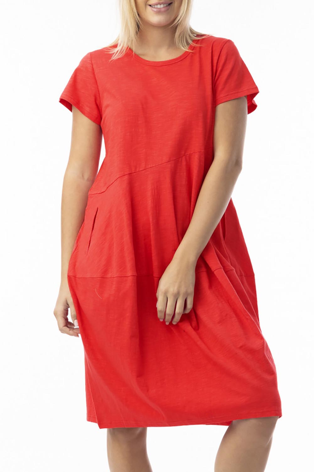 A model wearing the Essentials Organic Cotton Bubble Dress in colour Red (Red), from the front, cropped image