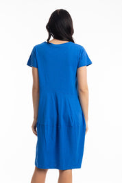 A model wearing the Essentials Knit Bubble Dress in colour Electricbl (Blue), from the back