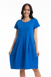 A model wearing the Essentials Knit Bubble Dress in colour Electricbl (Blue), from the front, cropped image