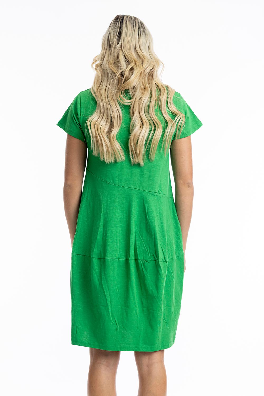 A model wearing the Essentials Knit Bubble Dress in colour Parakeet (Green), from the back