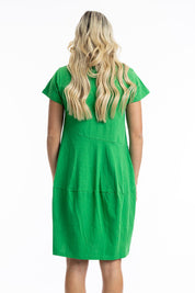 A model wearing the Essentials Knit Bubble Dress in colour Parakeet (Green), from the back