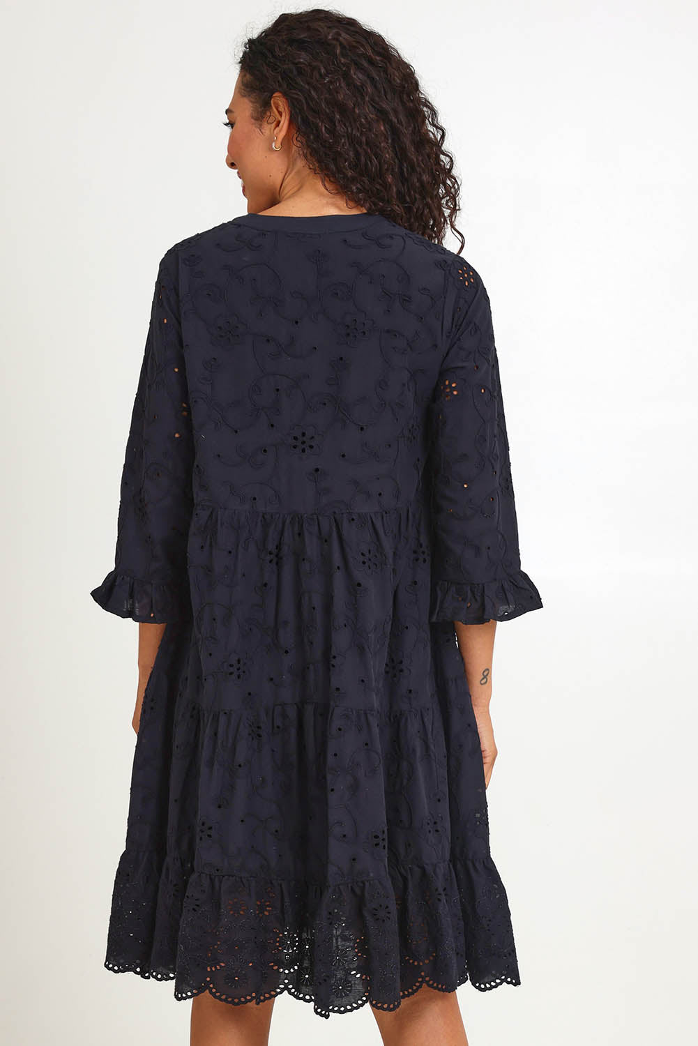 Model Pamelar wearing size 10 of the Essentials Broderie Frill Hem and Sleeves Dress - Black in colour Black, from the back