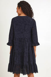 Model Pamelar wearing size 10 of the Essentials Broderie Frill Hem and Sleeves Dress - Black in colour Black, from the back