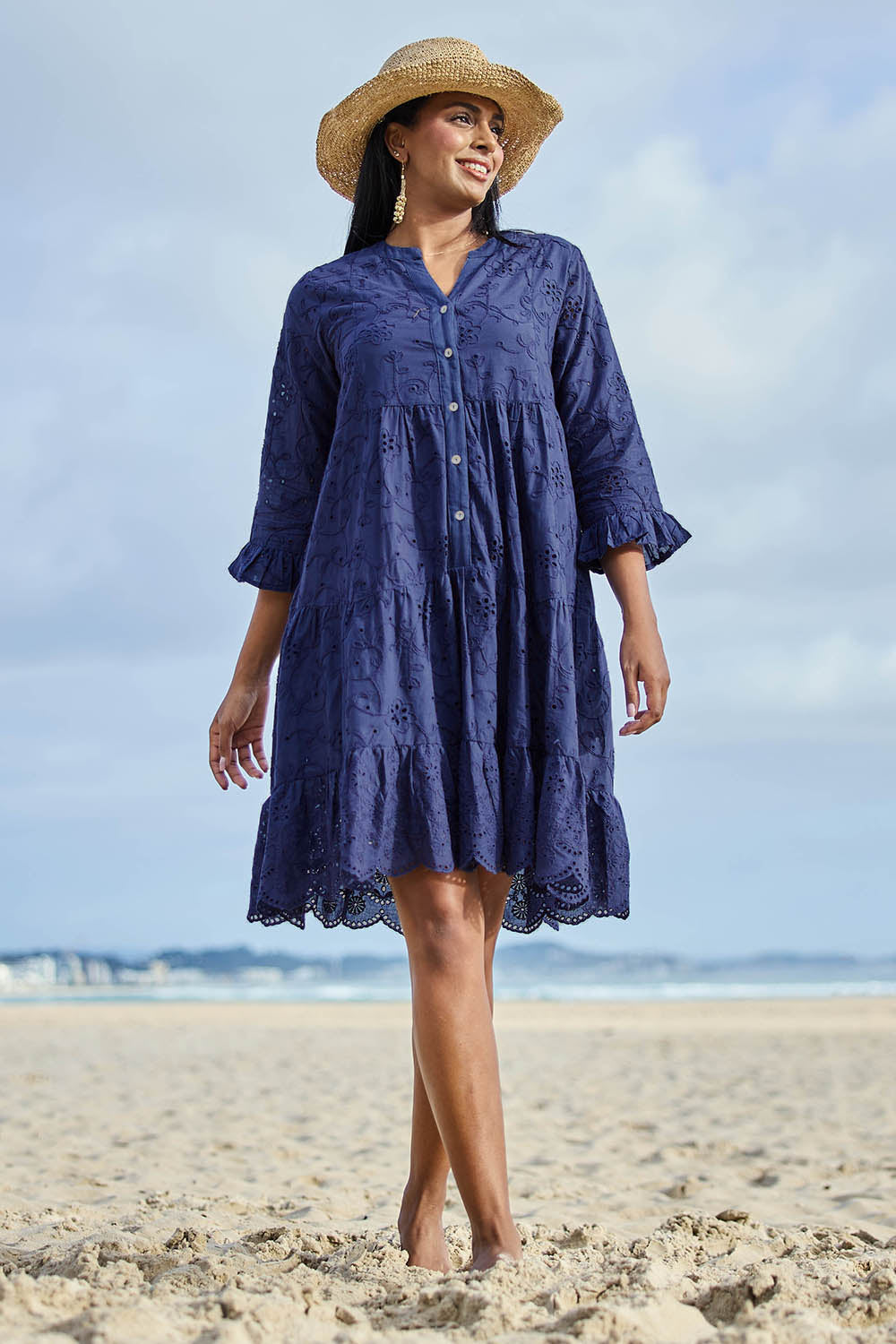 Model Eshan wearing size 10 of the Essentials Broderie Frill Hem And Sleeves Dress - Navy in colour Navy, from the front
