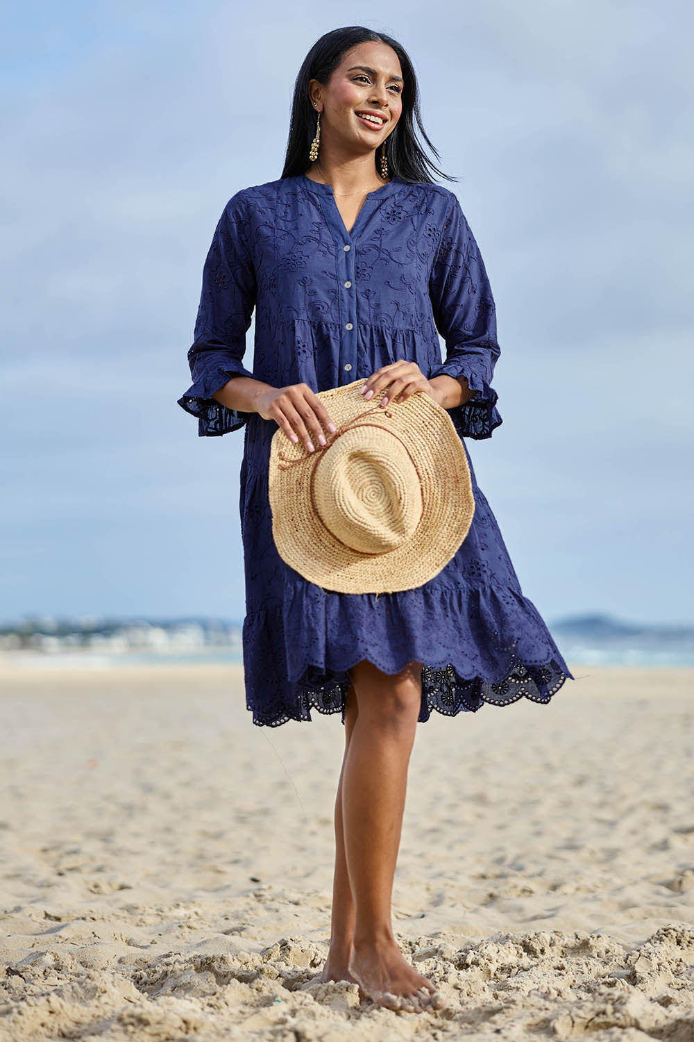 Model Eshan wearing size 10 of the Essentials Broderie Frill Hem And Sleeves Dress - Navy in colour Navy, from the front