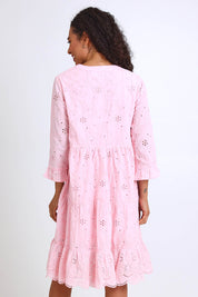 Model Pamelar wearing size 10 of the Essentials Broderie Frill Hem and Sleeves Dress - Pink in colour Pink, from the back