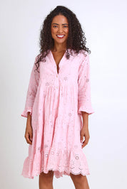 Model Pamelar wearing size 10 of the Essentials Broderie Frill Hem and Sleeves Dress - Pink in colour Pink, in a cropped view