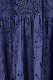 Product shot of the Essentials Broderie Layers Dress - Navy in colour Navy, showing detail
