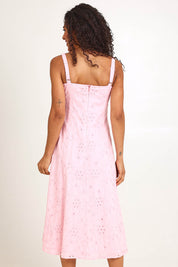 Model Pamelar wearing size 10 of the Essentials Broderie Strappy Cotton Dress - Pink in colour Pink, from an angle