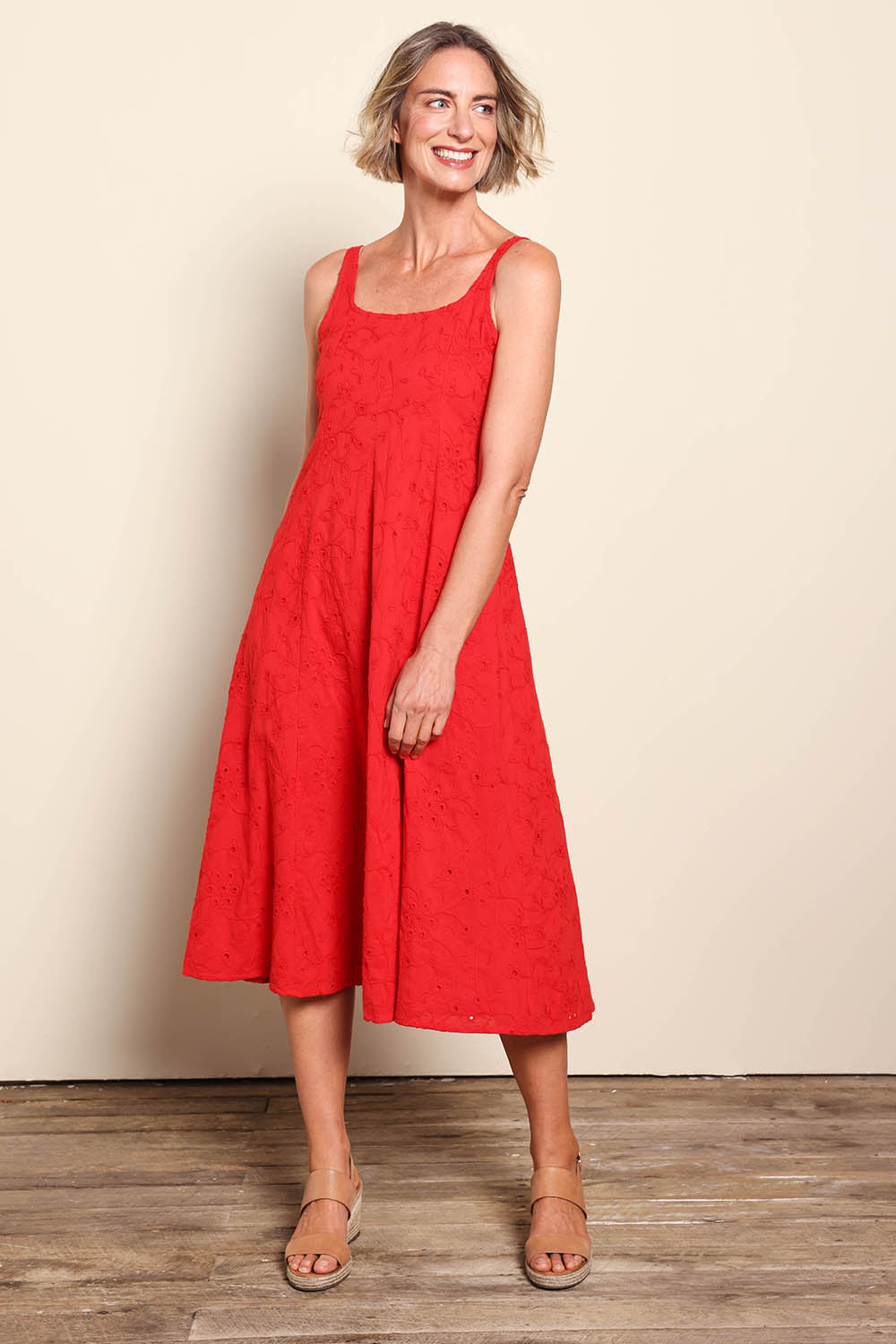 Model Riinar wearing size 10 of the Essentials Broderie Strappy Cotton Dress - Red in colour Red, from the front