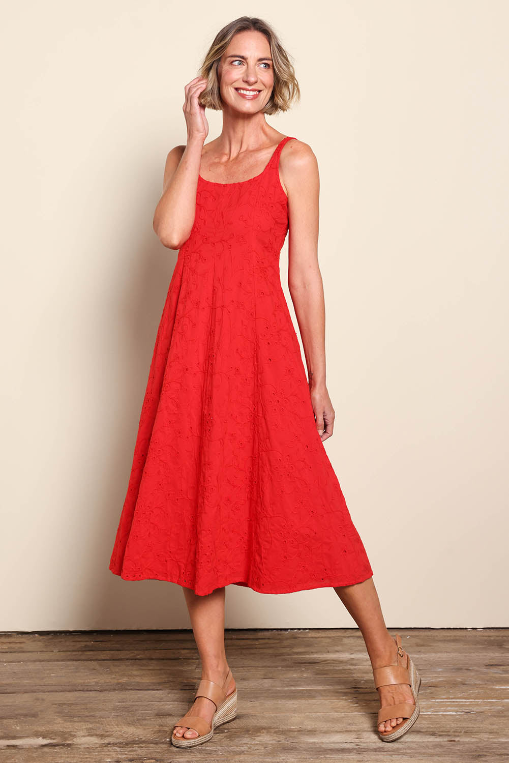 Model Riinar wearing size 10 of the Essentials Broderie Strappy Cotton Dress - Red in colour Red, from the front