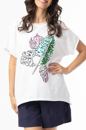A model wearing the Embellished Cotton Tee in colour Whitepalm (White), from the front, cropped image