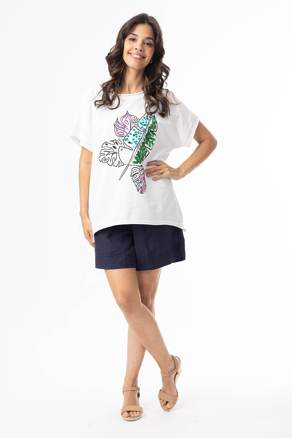 A model wearing the Embellished Cotton Tee in colour Whitepalm (White), from the front, showing the whole outfit