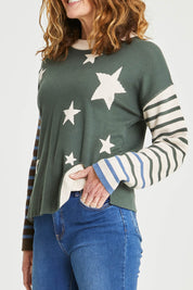 Model Emma wearing size 10 of the Knit Reversible Organic Cotton Jumper in colour Colour1 (Green), from the front, cropped image