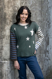 A model wearing the Knit Reversible Organic Cotton Jumper in colour Colour1 (Green), from the front, showing the whole outfit