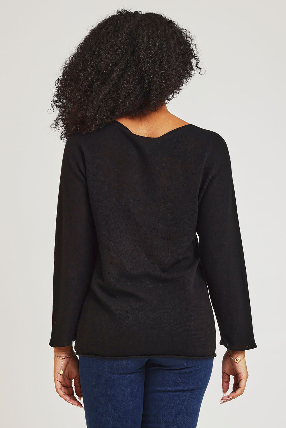 Model Ziara wearing size 10 of the Essentials Organic Cotton Boat Ls Neck Top in colour Black (Black), from the back