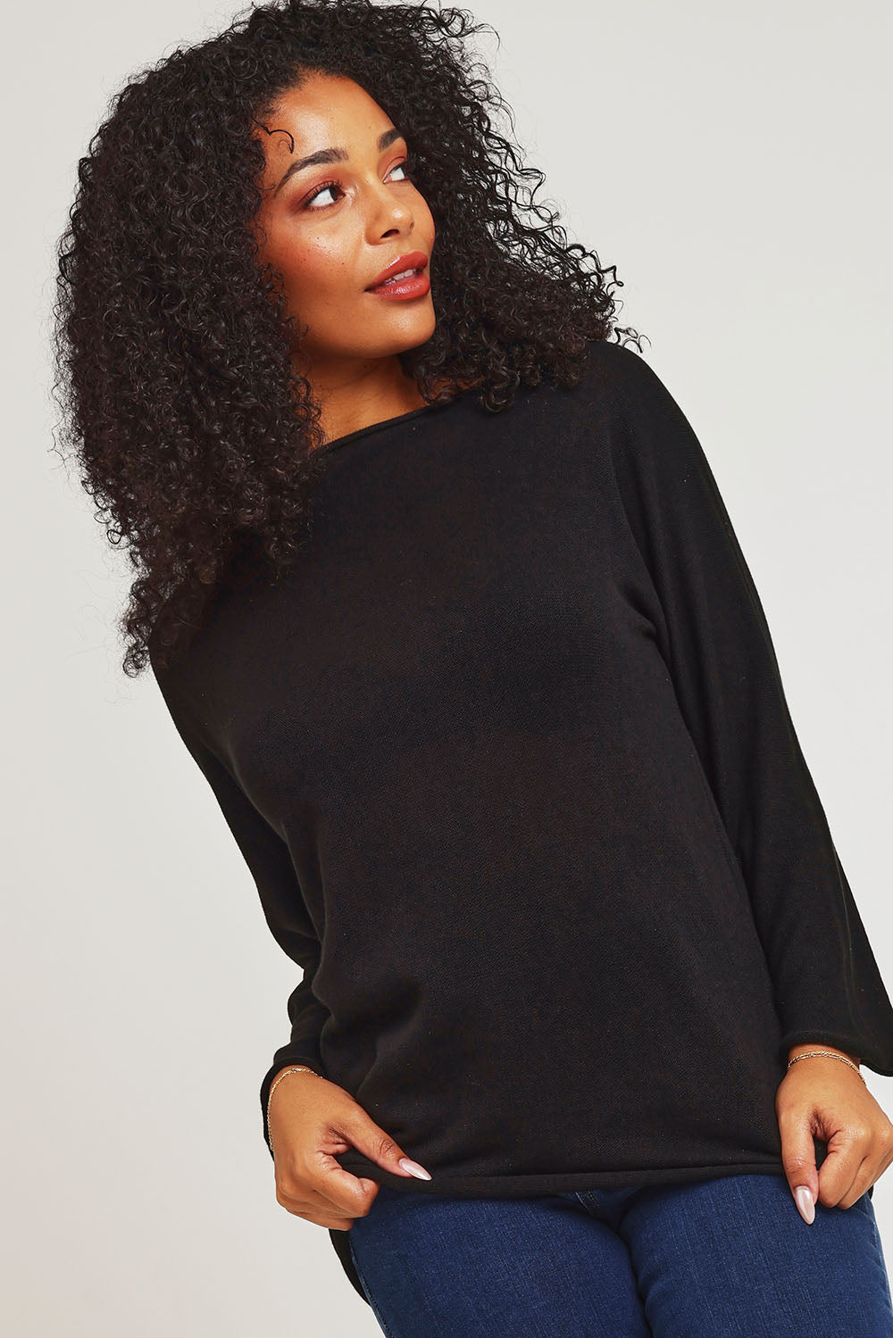 Model Ziara wearing size 10 of the Essentials Organic Cotton Boat Ls Neck Top in colour Black (Black), from the front, cropped image