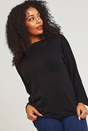 Model Ziara wearing size 10 of the Essentials Organic Cotton Boat Ls Neck Top in colour Black (Black), from the front, cropped image