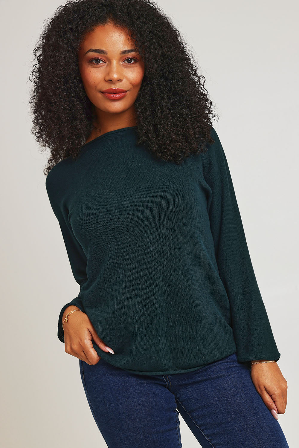 Model Ziara wearing size 10 of the Essentials Organic Cotton Boat Ls Neck Top in colour Pine (Green), from the front, cropped image
