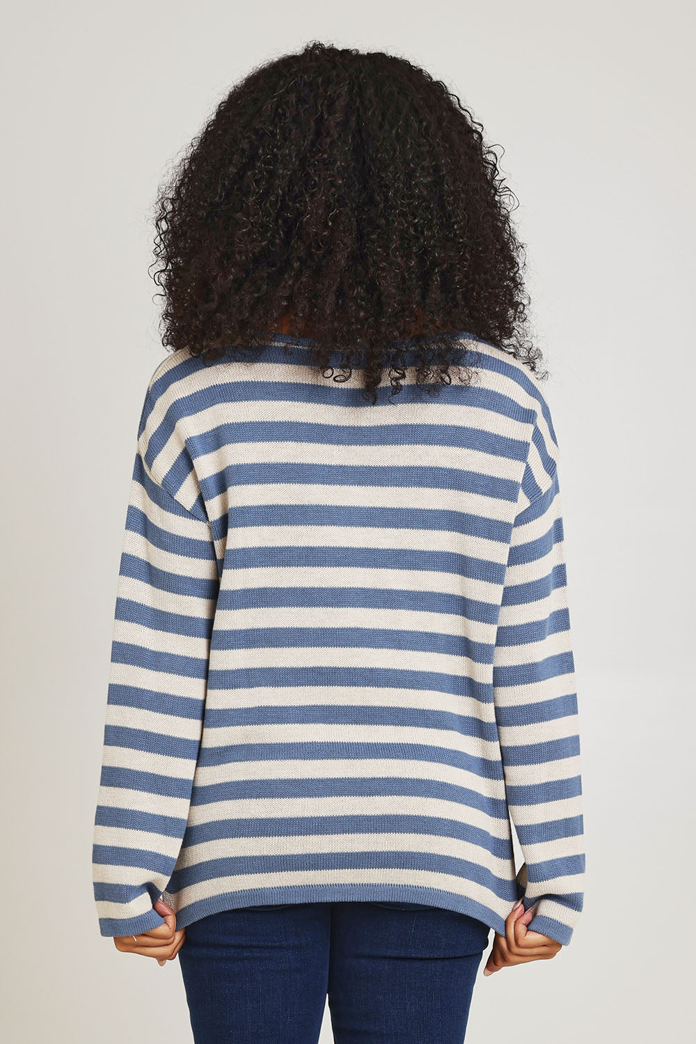 Model Ziara wearing size 10 of the Essentials Organic Cotton Knit Stripe Top in colour Denim (Blue), from the back