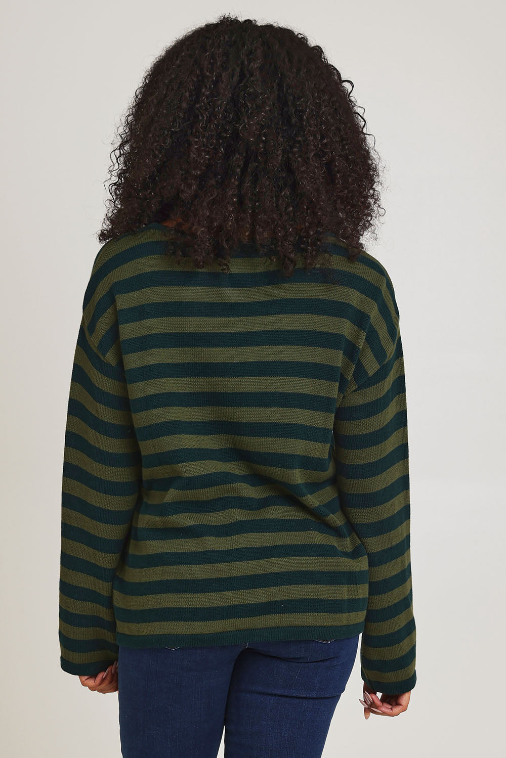 Model Ziara wearing size 10 of the Essentials Organic Cotton Knit Stripe Top in colour Pineolive (Green), from the back