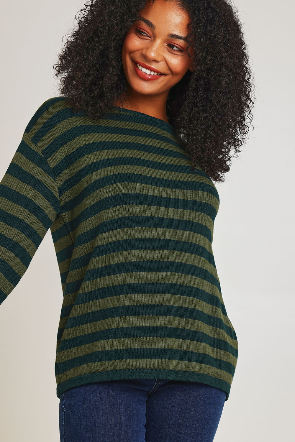 Model Ziara wearing size 10 of the Essentials Organic Cotton Knit Stripe Top in colour Pineolive (Green), from the front, cropped image